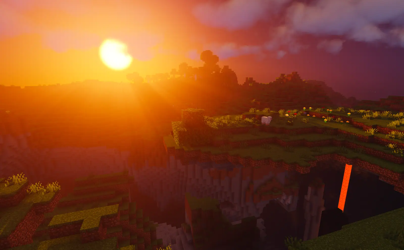 Zonsondergang met godrays boven het survival-landschap met een lavaval